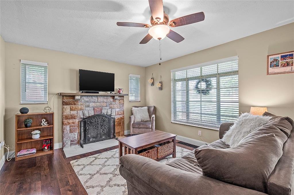 8 Ellen Drive McKees Rocks, PA 15136 - Photo 6 of 25 a living room with furniture a flat screen tv and a fireplace
