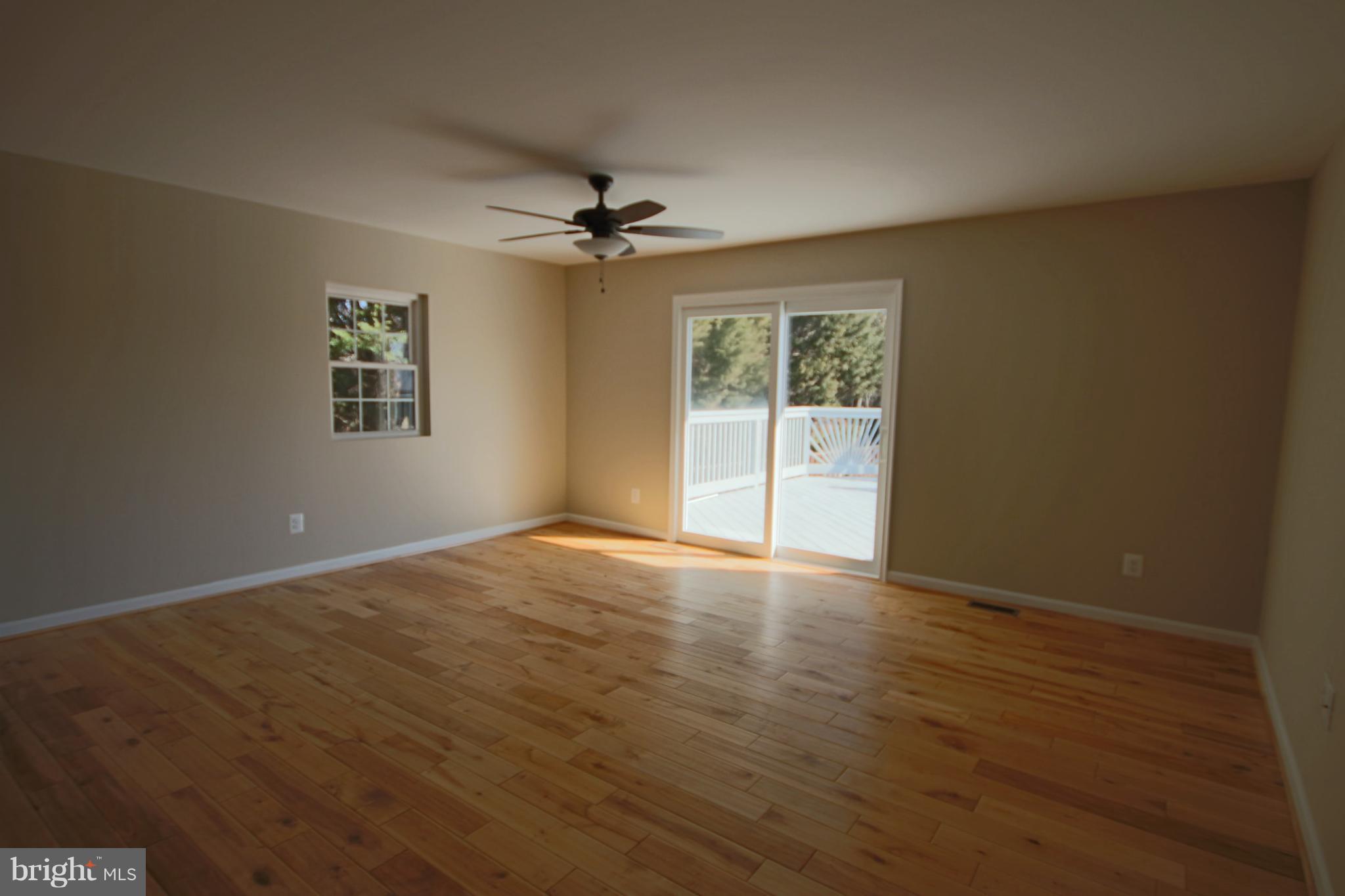 215 Kenwood Road Pasadena, MD 21122 - Photo 4 of 22 Living Room w/wood floors & sliders to deck