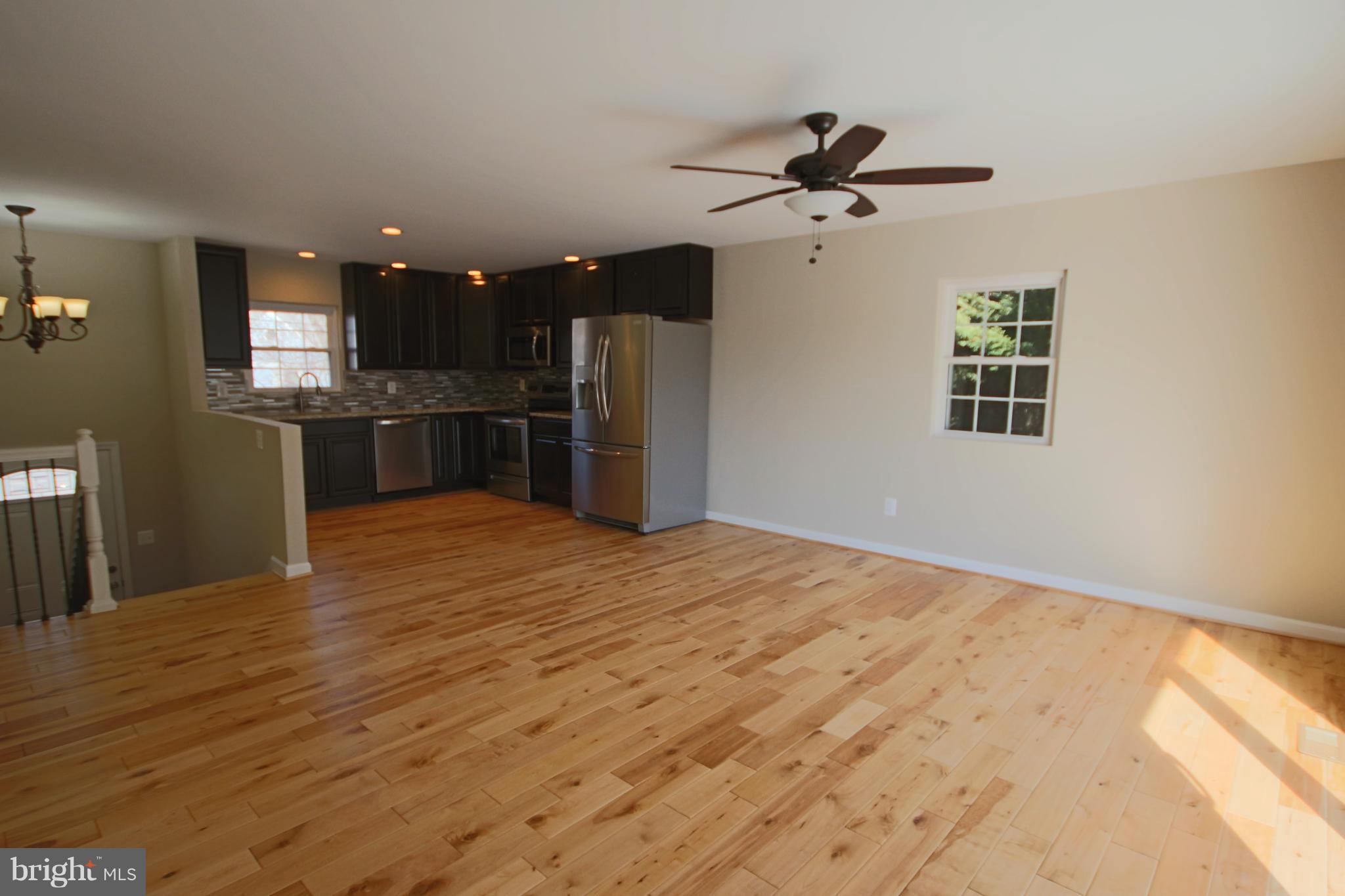 215 Kenwood Road Pasadena, MD 21122 - Photo 5 of 22 Living/Dining & Kitchen areas.