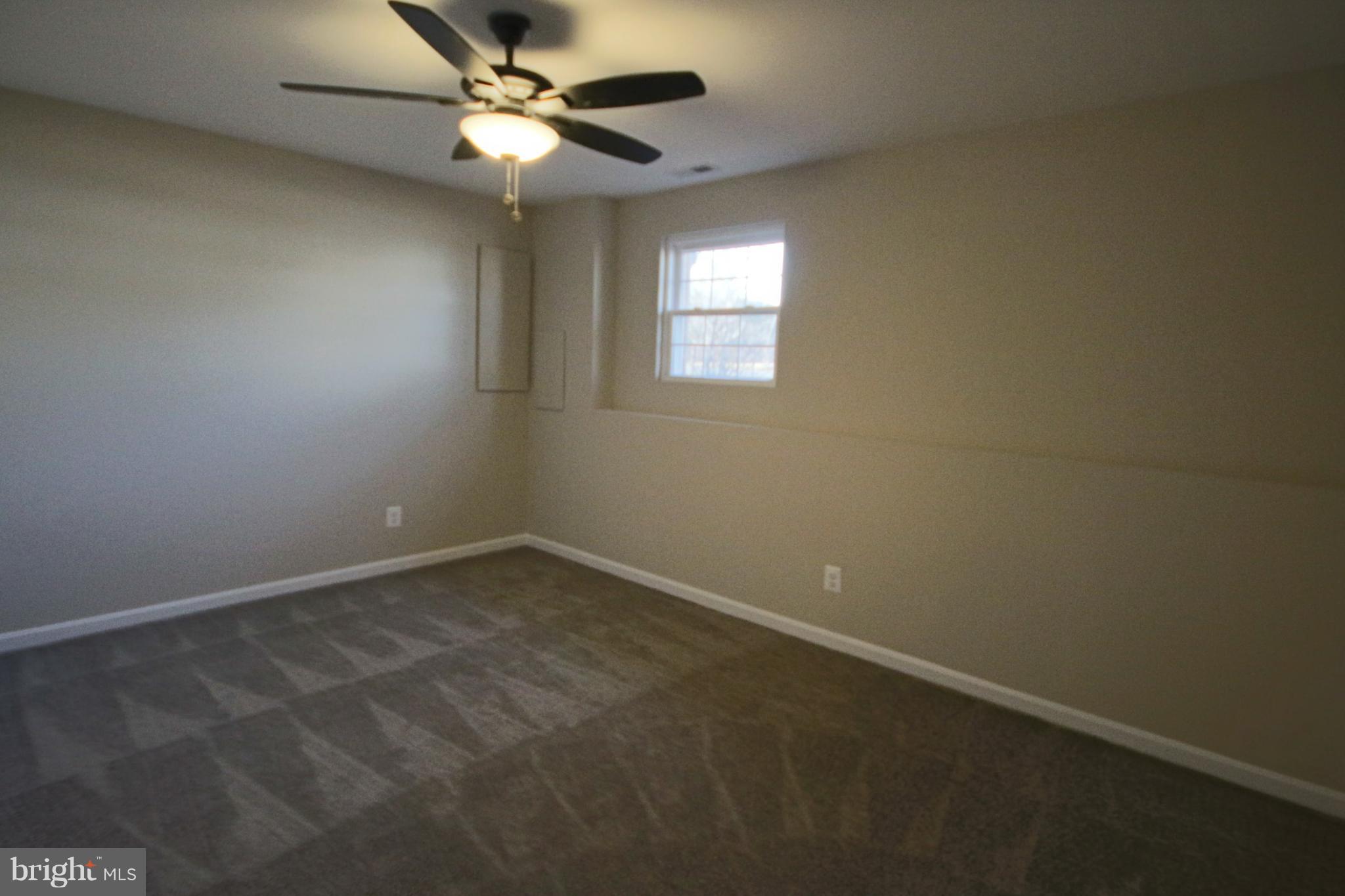 215 Kenwood Road Pasadena, MD 21122 - Photo 9 of 22 Bedroom on lower level w/ceiling fan