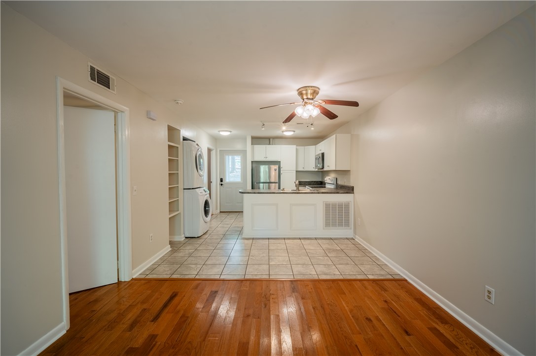 150 Ligon Street, Unit 2302 Clemson, SC 29631 - Photo 8 of 18 This inviting space offers an open concept design with a functional kitchen and warm hardwood floors.