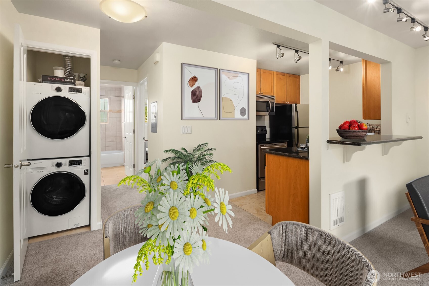 3636 Evanston Avenue North, Unit 12 Seattle, WA 98103 - Photo 12 of 17 a bedroom with a bed and ceiling fan