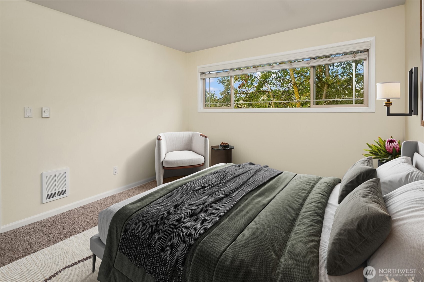 3636 Evanston Avenue North, Unit 12 Seattle, WA 98103 - Photo 15 of 17 a bedroom with a bed and window