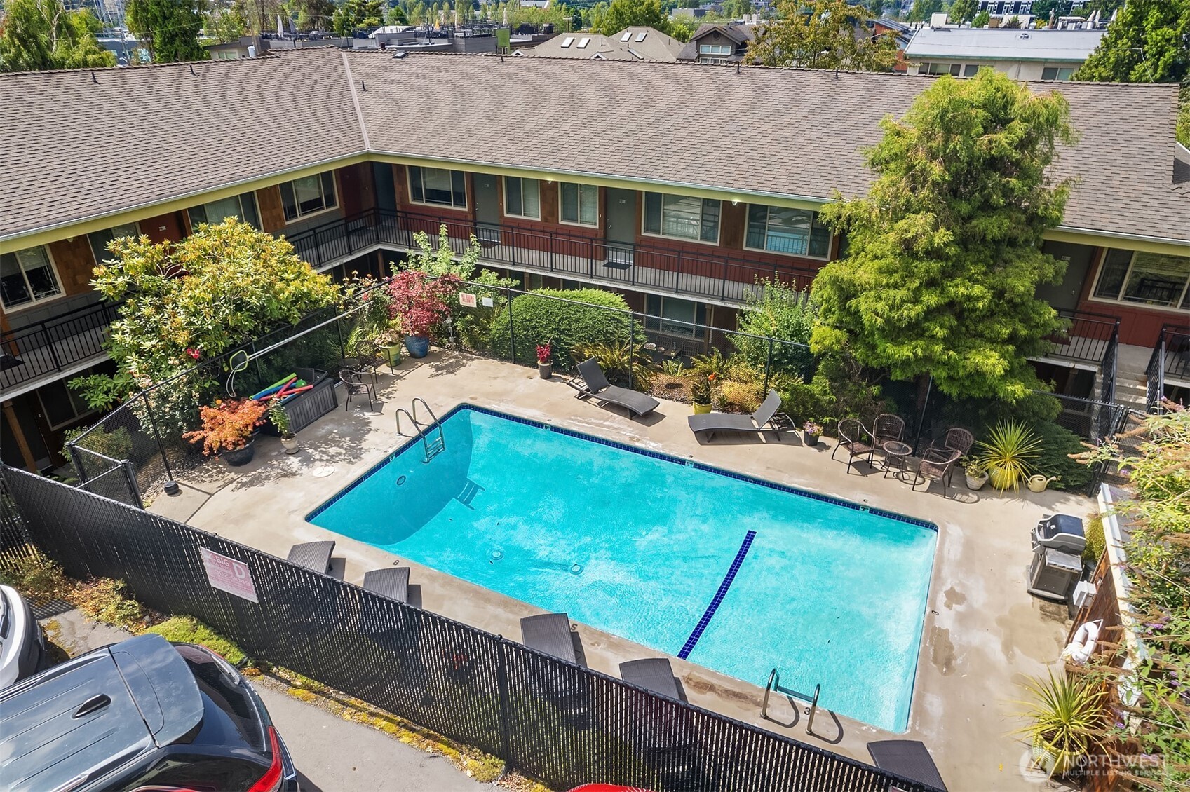 3636 Evanston Avenue North, Unit 12 Seattle, WA 98103 - Photo 17 of 17 an aerial view of a house with a swimming pool