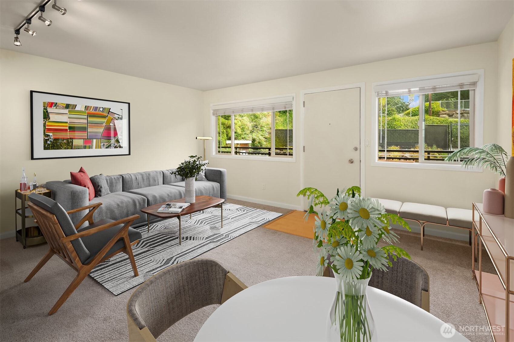 3636 Evanston Avenue North, Unit 12 Seattle, WA 98103 - Photo 10 of 17 a living room with furniture plant and a window