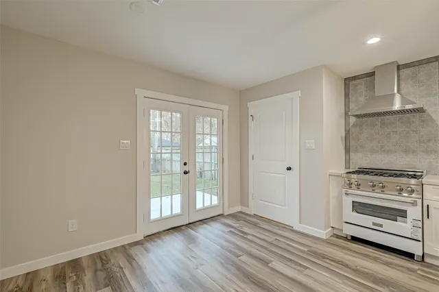 a kitchen with a stove oven and sink
