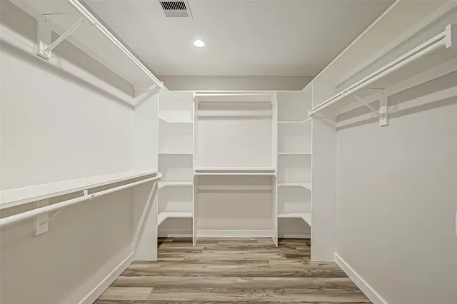 a bathroom with a double sink shower and a mirror