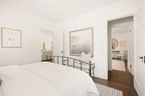 a bedroom with a bed and a table