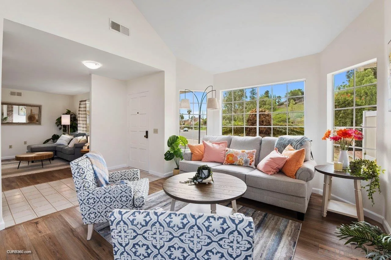 1373 Crestview Drive Oceanside, CA 92056 - Photo 11 of 33 a living room with furniture and a large window