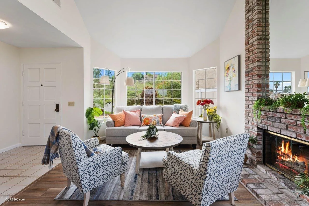 1373 Crestview Drive Oceanside, CA 92056 - Photo 12 of 33 a living room with furniture a fireplace and a table