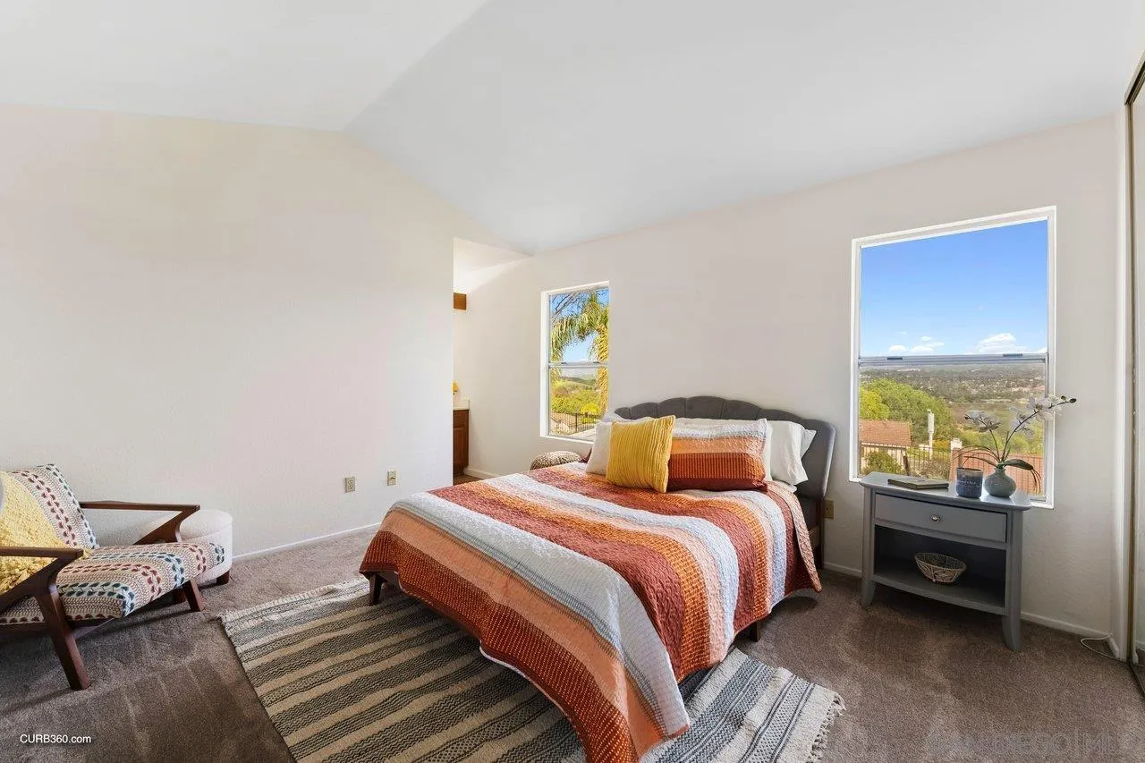 1373 Crestview Drive Oceanside, CA 92056 - Photo 24 of 33 a bedroom with a bed and a couch