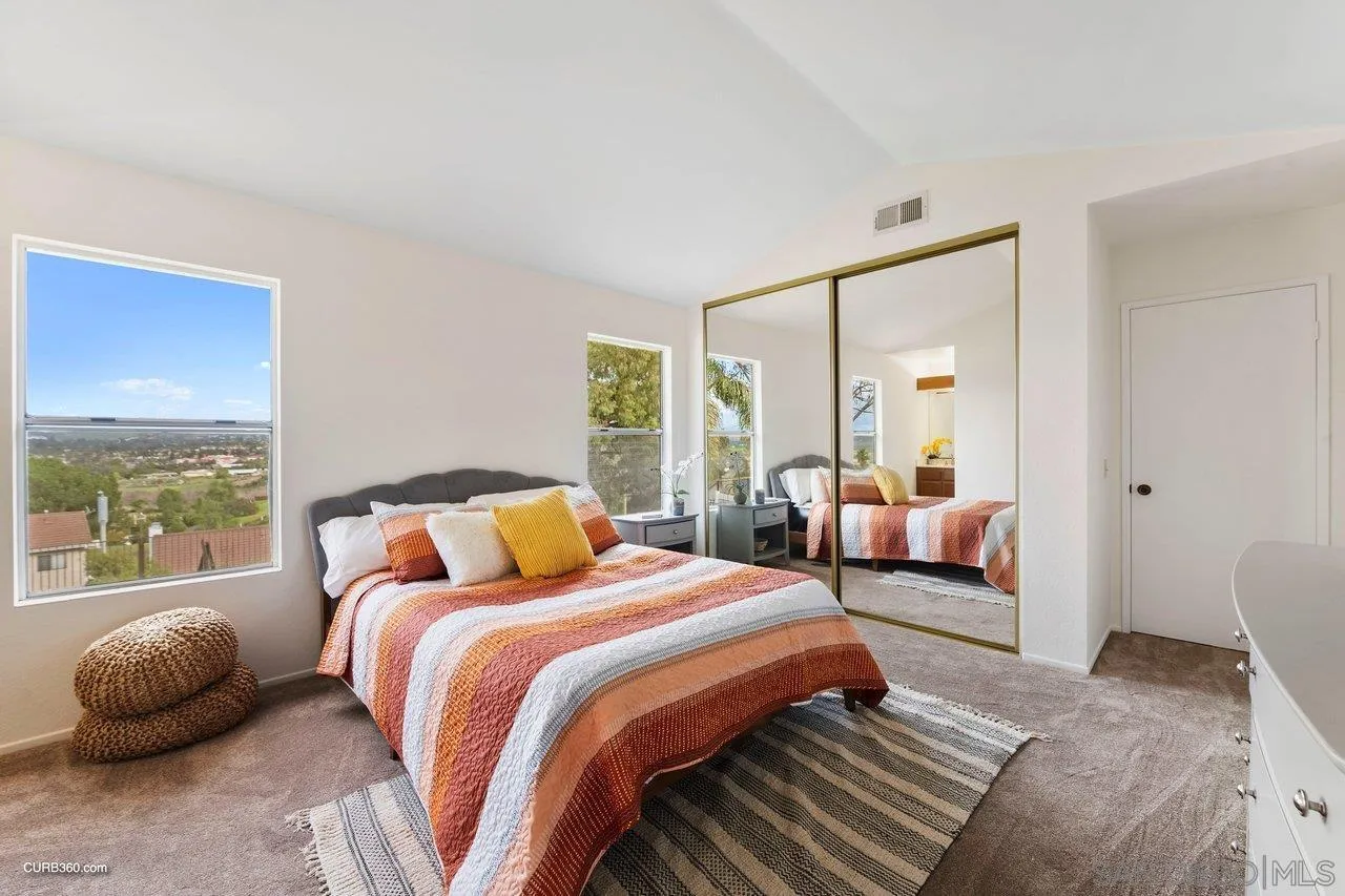 1373 Crestview Drive Oceanside, CA 92056 - Photo 25 of 33 a bedroom with two beds and a large window