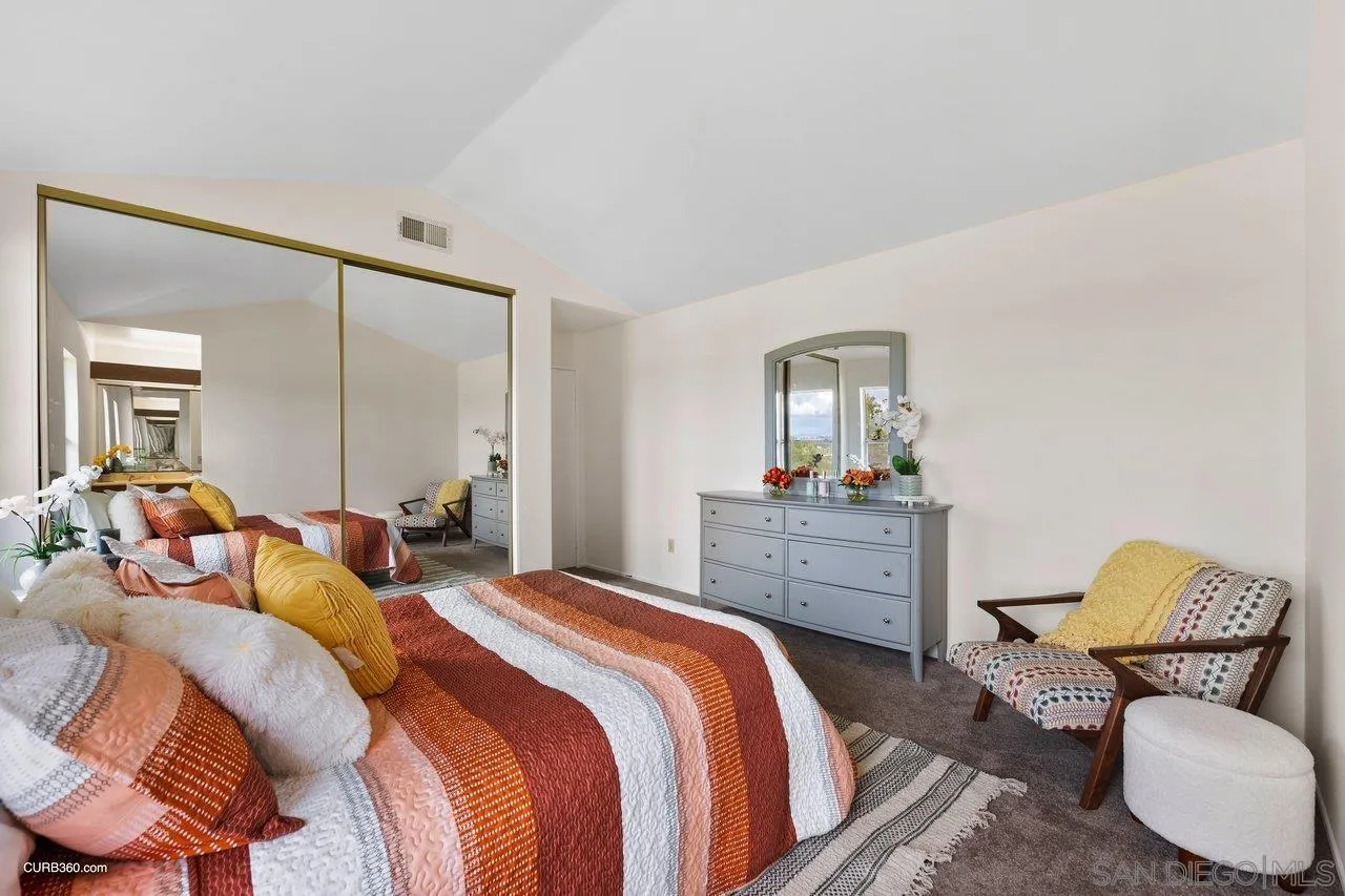 1373 Crestview Drive Oceanside, CA 92056 - Photo 26 of 33 a bedroom with a bed and wooden floor