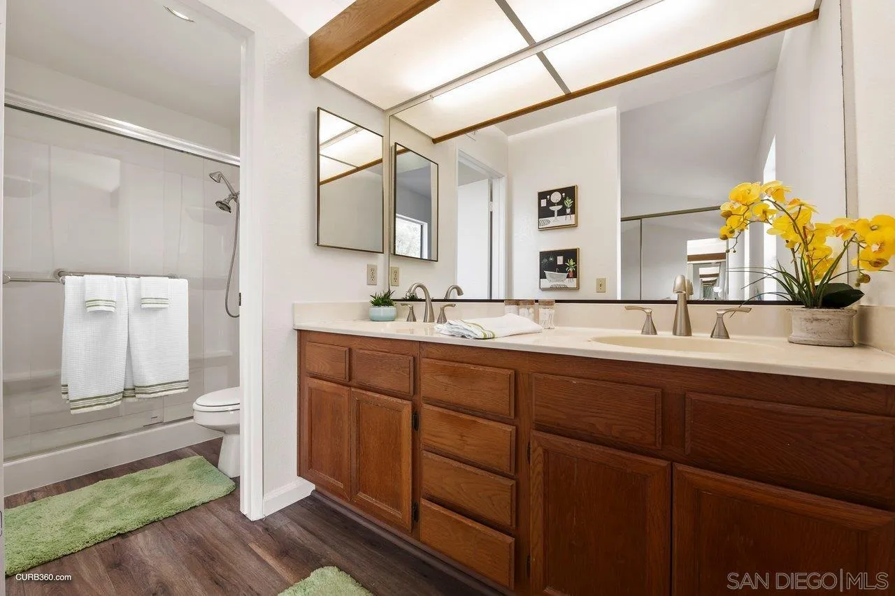 1373 Crestview Drive Oceanside, CA 92056 - Photo 28 of 33 a spacious bathroom with a double vanity sink mirror and