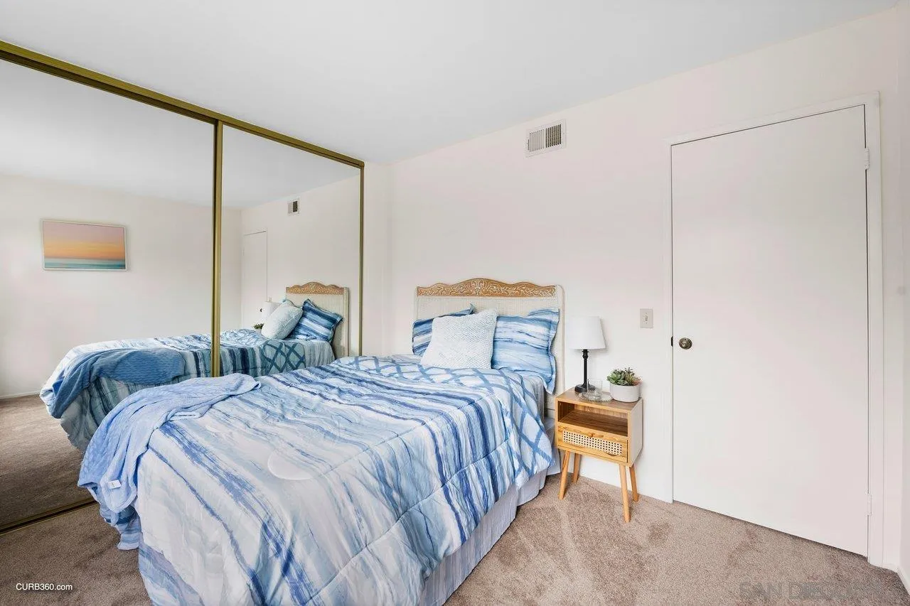 1373 Crestview Drive Oceanside, CA 92056 - Photo 30 of 33 a bedroom with a bed and a cabinets
