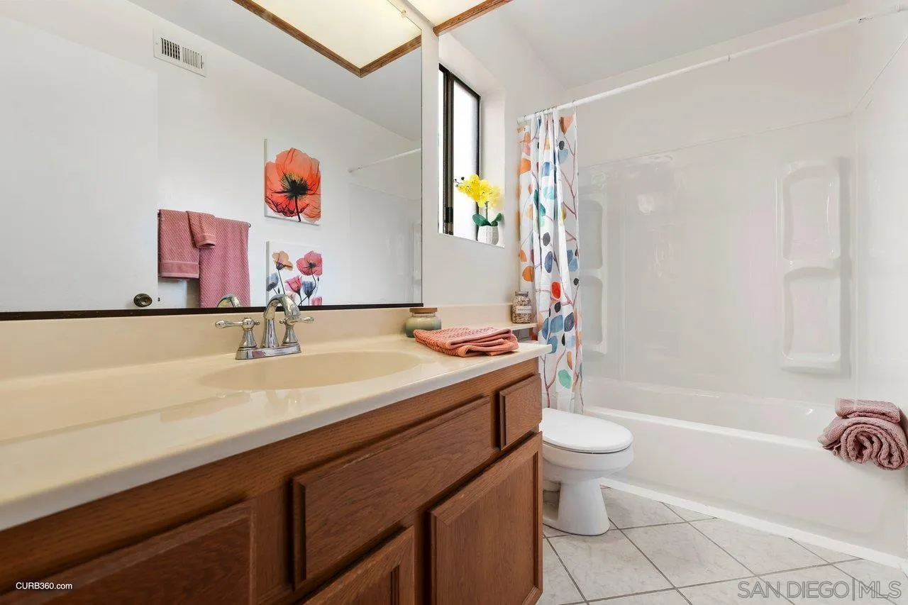 1373 Crestview Drive Oceanside, CA 92056 - Photo 31 of 33 a bathroom with a sink a toilet and a bathtub