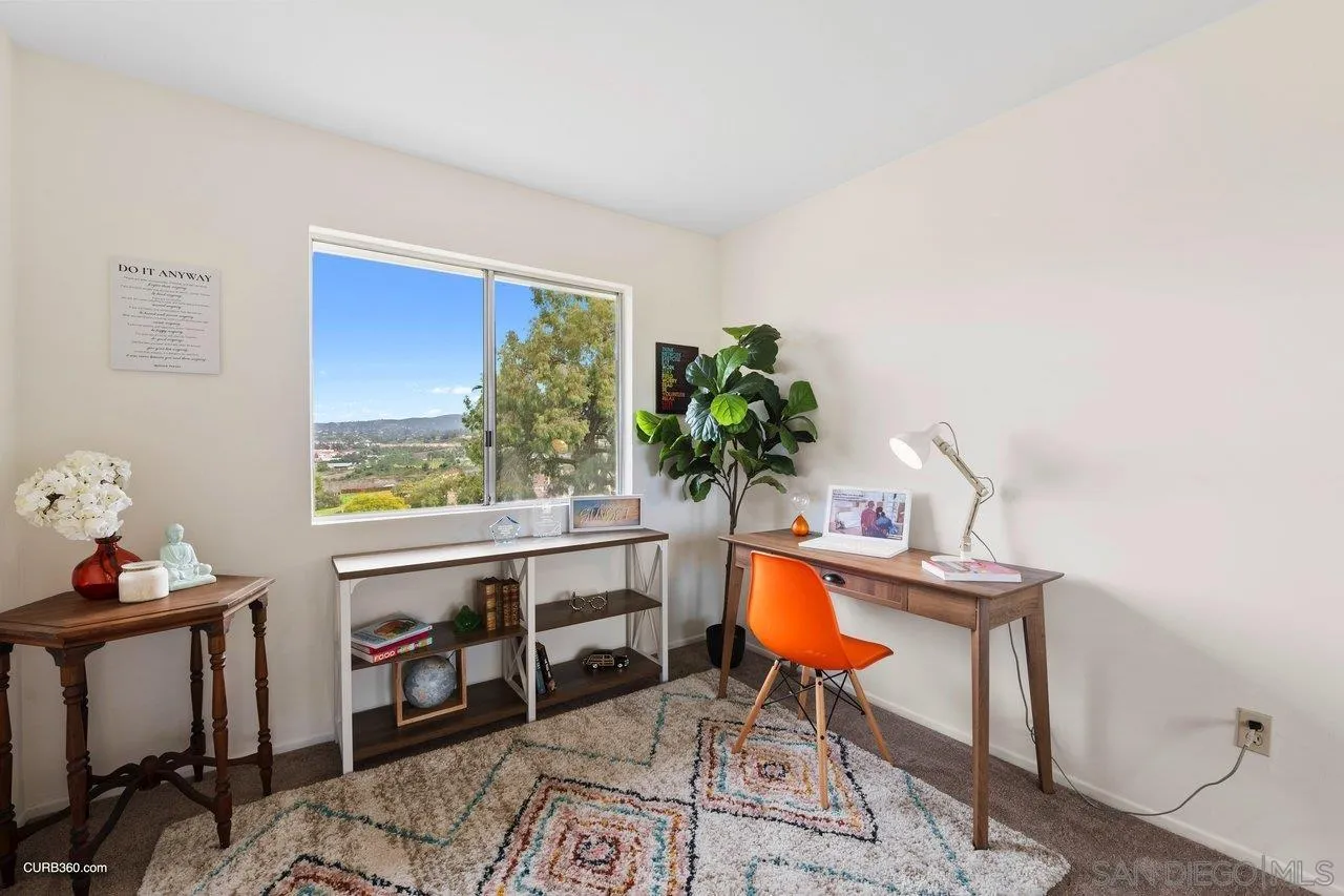 1373 Crestview Drive Oceanside, CA 92056 - Photo 32 of 33 a room with furniture and a potted plant