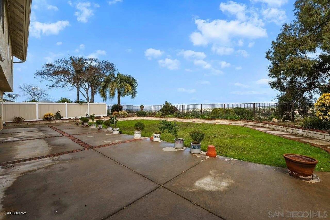 1373 Crestview Drive Oceanside, CA 92056 - Photo 33 of 33 a view of a street with a yard and palm trees