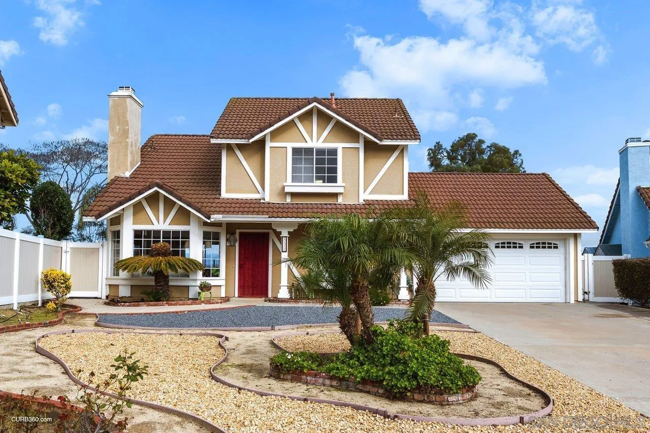 1373 Crestview Drive Oceanside, CA 92056 - Photo 4 of 33 a front view of a house with a yard