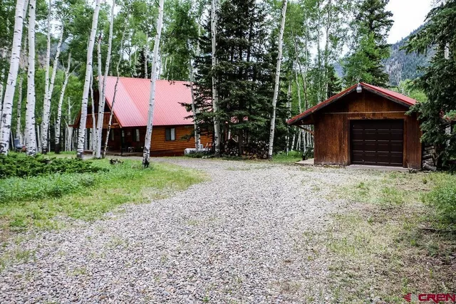 a small barn with a small yard