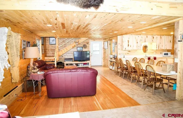 a view of a patio with table and chairs