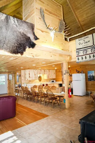 a living room with lots of furniture and a large window