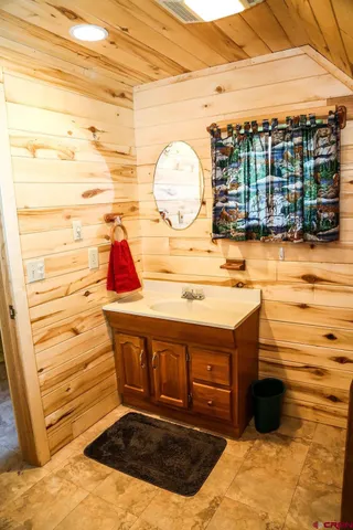 a view of a house with a big yard and garden