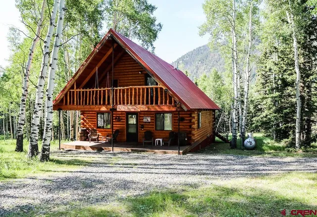 a backyard of a house with barbeque oven