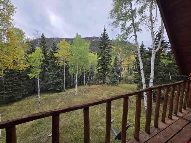 a view of front of house with a yard