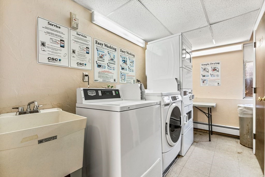 80 Walnut Street, Unit 410 Canton, MA 02021 - Photo 21 of 21 a utility room with dryer and washer