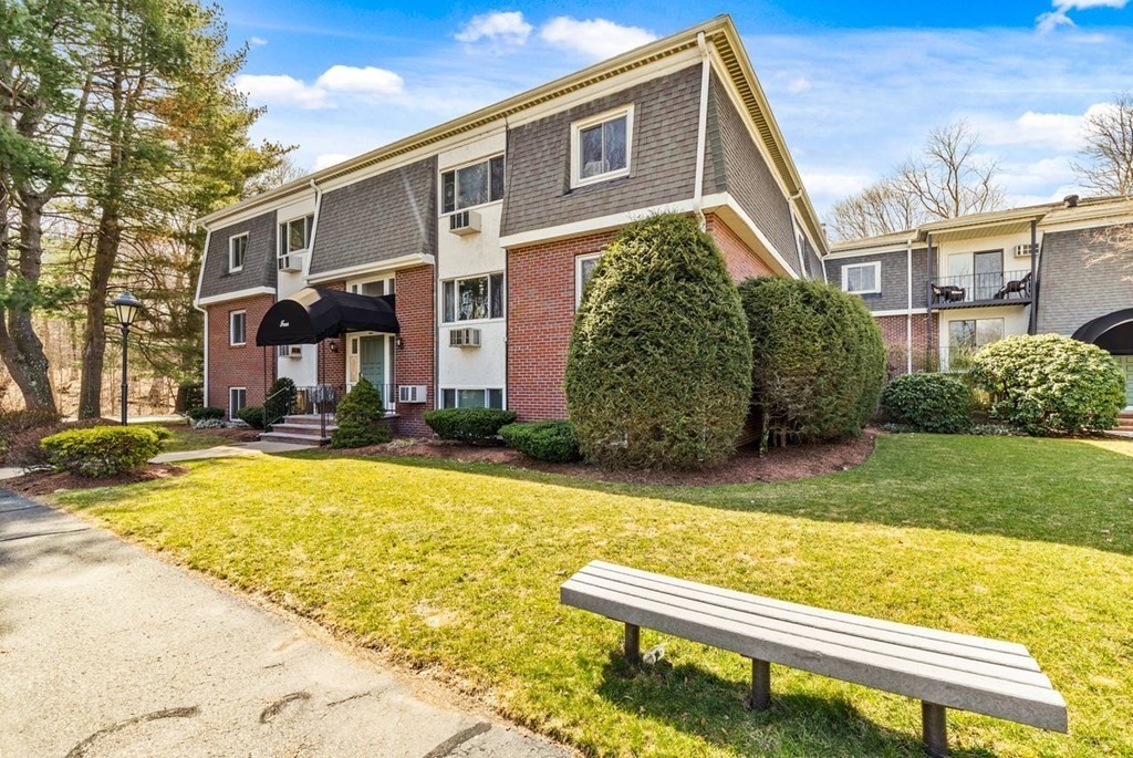 80 Walnut Street, Unit 410 Canton, MA 02021 - Photo 3 of 21 a front view of a house with swimming pool