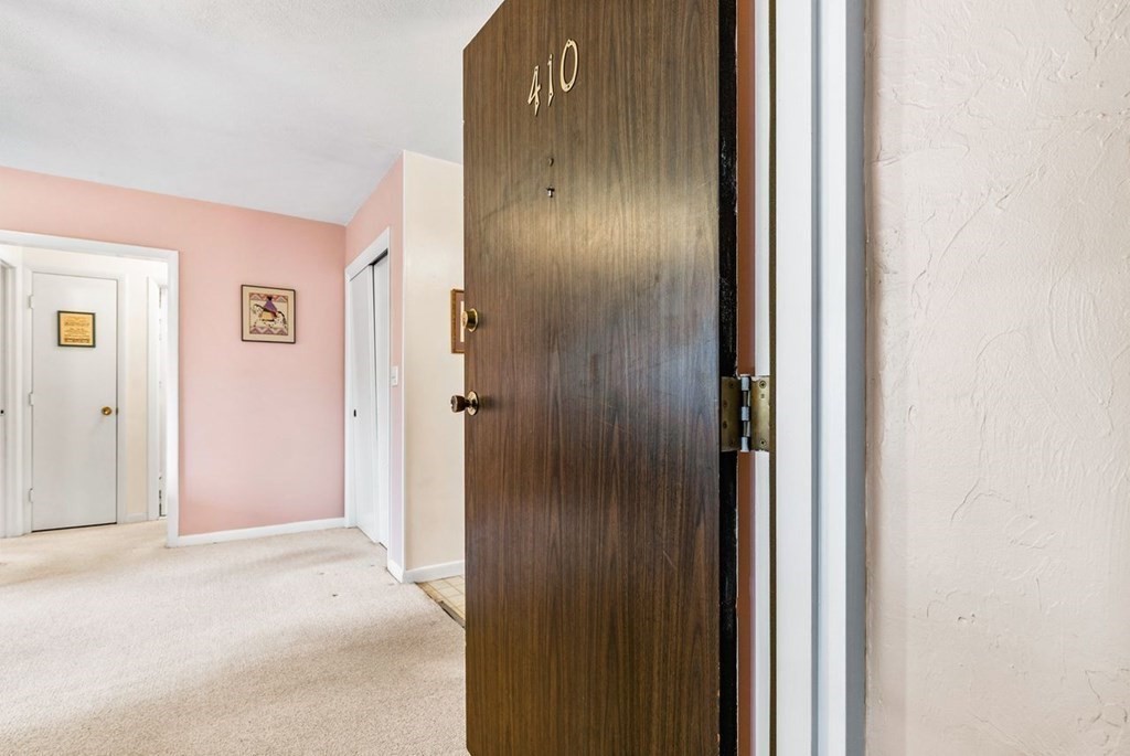 80 Walnut Street, Unit 410 Canton, MA 02021 - Photo 6 of 21 a view of a hallway with wooden floor