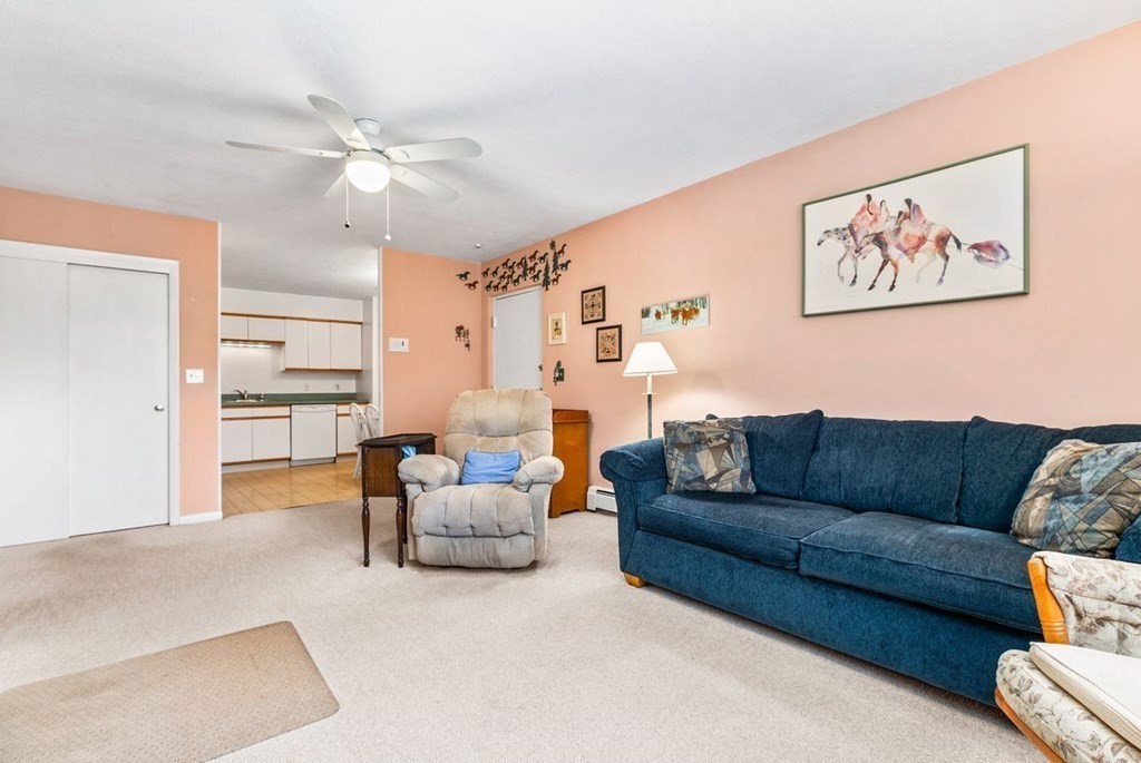80 Walnut Street, Unit 410 Canton, MA 02021 - Photo 10 of 21 a living room with furniture and a large window