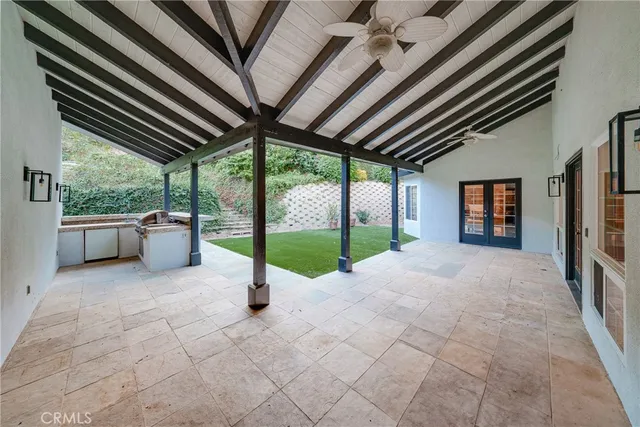 a front view of a house with a garden and porch