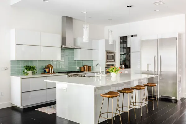 a kitchen with appliances cabinets and a counter top space