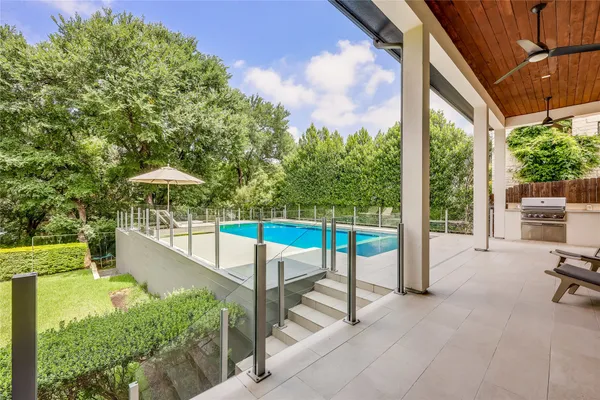a view of a swimming pool with a patio