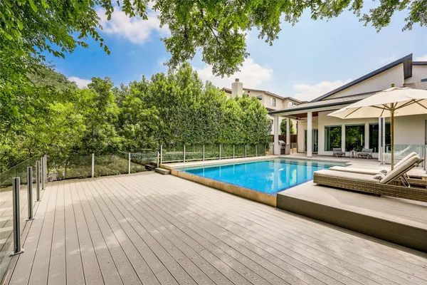swimming pool view with a outdoor seating