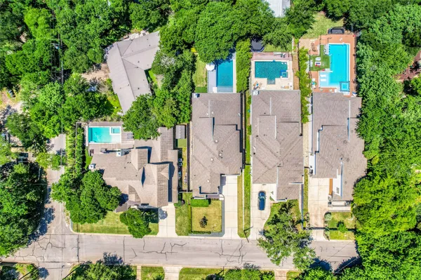 aerial view of a house with a yard and plants