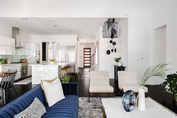 a living room with furniture and wooden floor