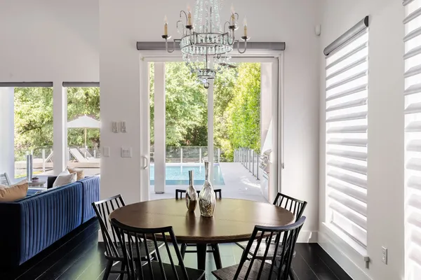 a view of a dining room with furniture and window