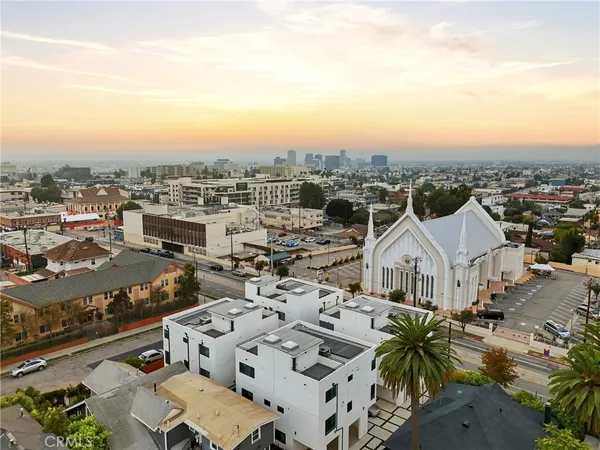 an aerial view of a house with a big yard