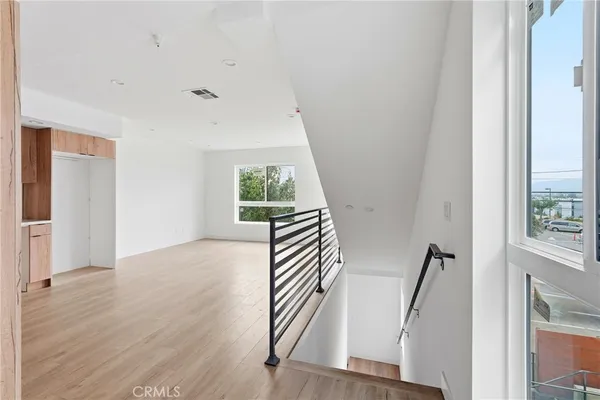 a view of an entryway with wooden floor
