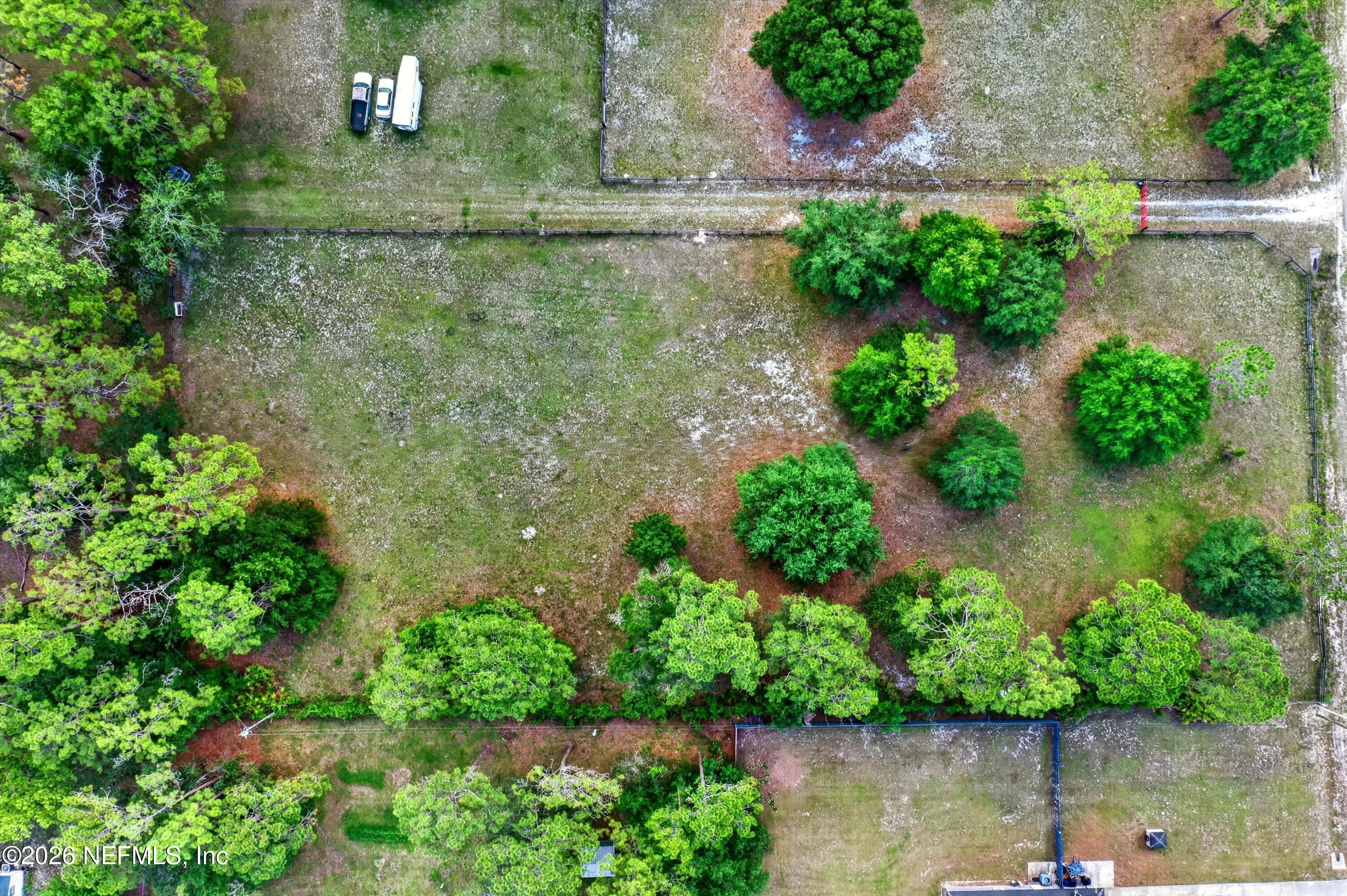 5214 Carter Spencer Road Middleburg, FL 32068 - Photo 29 of 50 an aerial view of a house with a yard and lake view