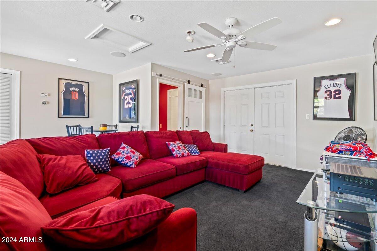 3841 East Elm Street Phoenix, AZ 85018 - Photo 54 of 72 a living room with furniture and a ceiling fan
