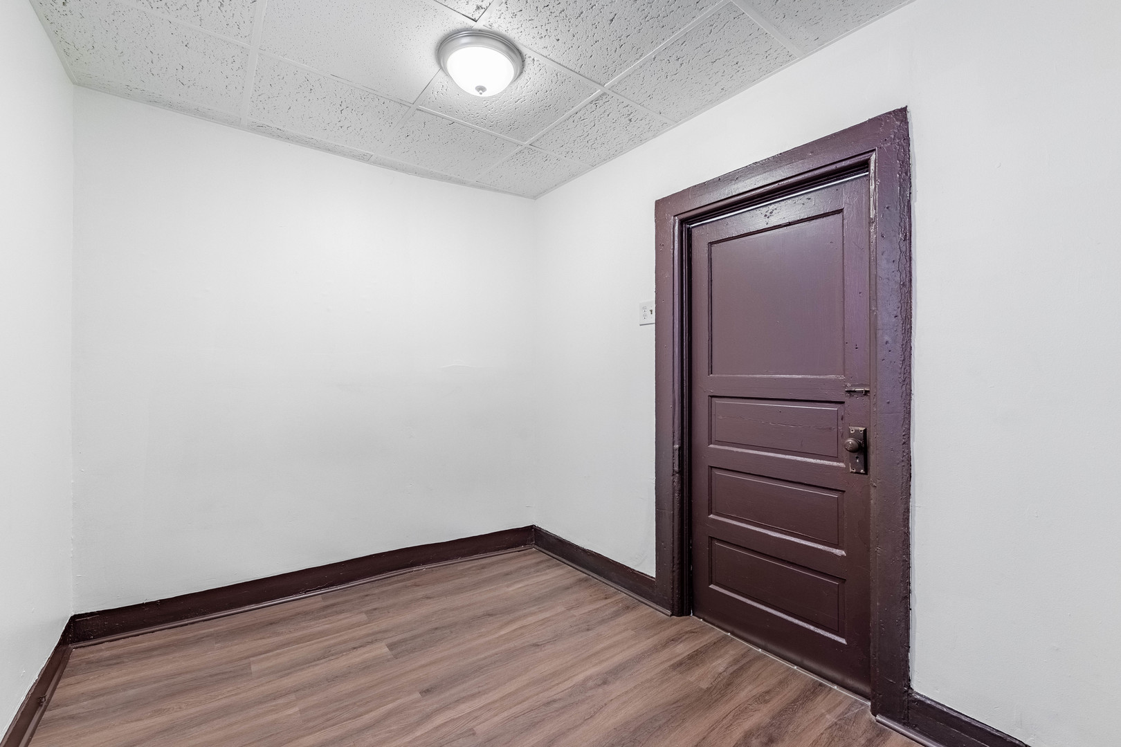 1115 West 17th Street, Unit 2F Chicago, IL 60608 - Photo 12 of 28 an empty room with wooden floor and closet