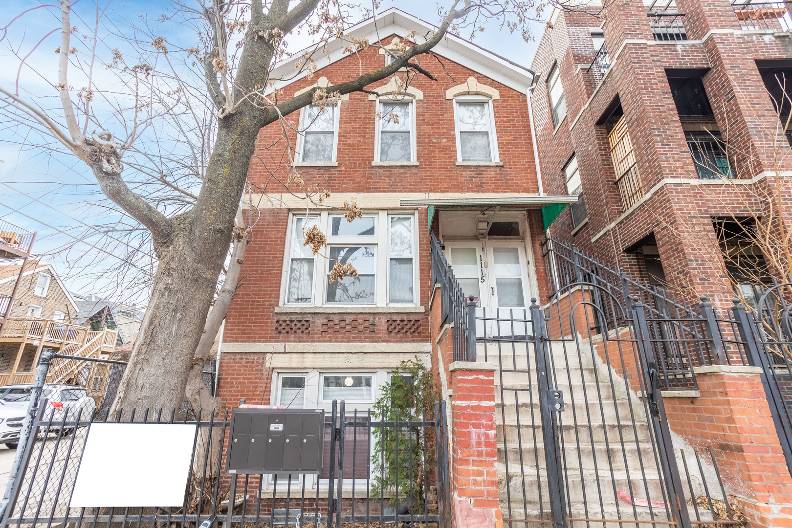 1115 West 17th Street, Unit 2F Chicago, IL 60608 - Photo 2 of 28 a front view of a multi story residential apartment building