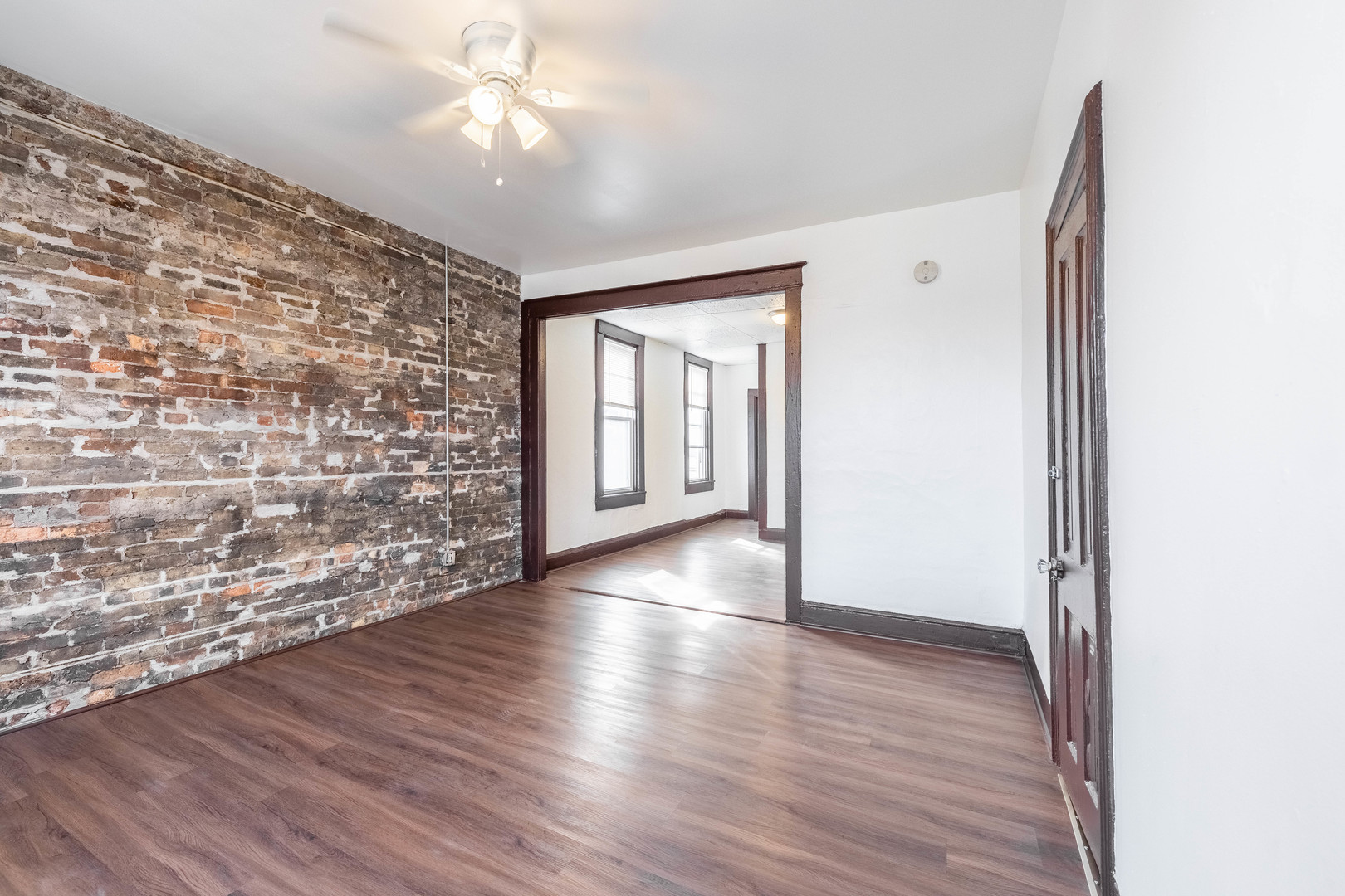1115 West 17th Street, Unit 2F Chicago, IL 60608 - Photo 7 of 28 wooden floor in an empty room with a window
