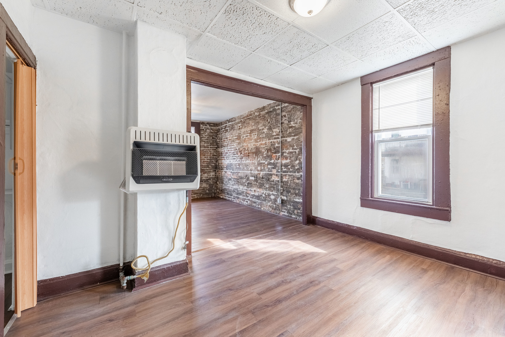 1115 West 17th Street, Unit 2F Chicago, IL 60608 - Photo 10 of 28 a view of empty room with wooden floor and fan