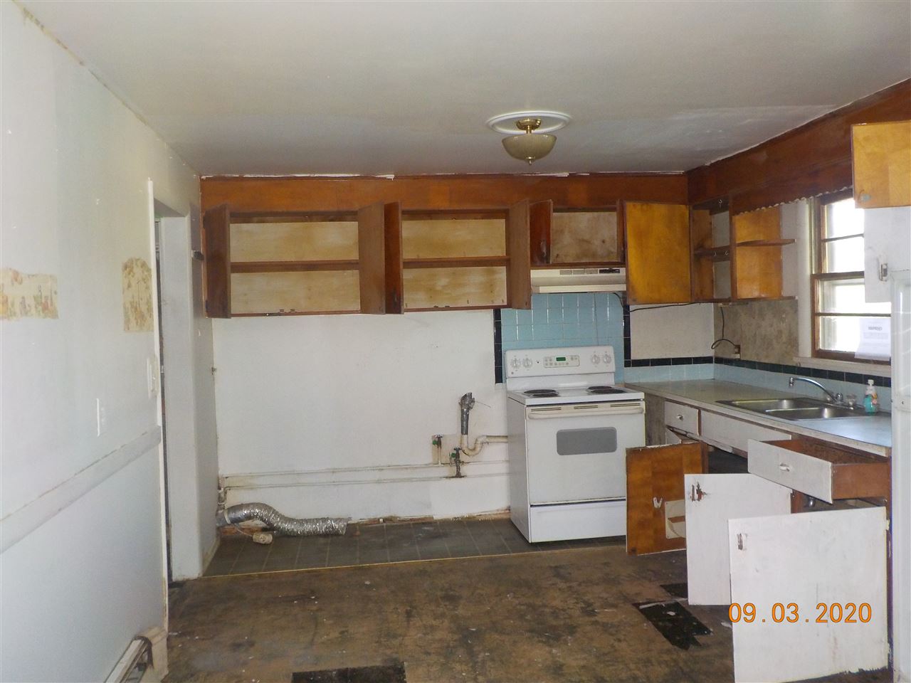 2945 Oak Ridge Road Mount Crawford, VA 22841 - Photo 5 of 19 a kitchen with a stove and cabinets
