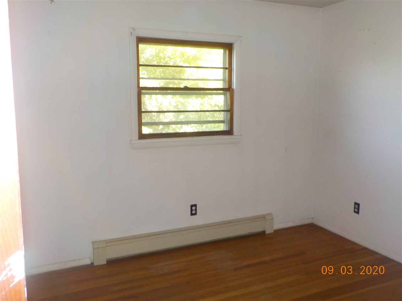 2945 Oak Ridge Road Mount Crawford, VA 22841 - Photo 9 of 19 a view of an empty room with wooden floor and a window